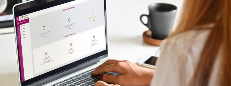 Business people in a meeting Business people using a laptop screen mockup in a meeting